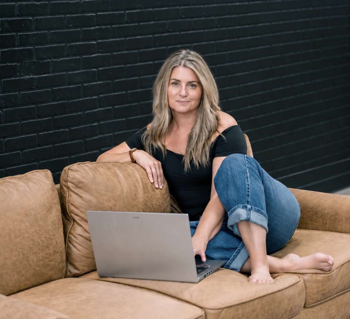 Founder of Person Centered Practice on her laptop working on her workshop